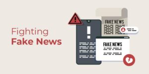 The image is centered around the theme of combating misinformation. It features various digital elements, such as a smartphone and a newspaper, displaying warnings and the word "FAKE" to signify false information. A red warning triangle with an exclamation mark further emphasizes the caution against fake news. The text "Fighting Fake News" is prominently displayed in red, indicating the serious nature of the topic. The color scheme uses muted tones with red highlights, creating a visual focus on the importance of addressing misinformation. This image is relevant to discussions around media literacy, fact-checking, and responsible journalism.