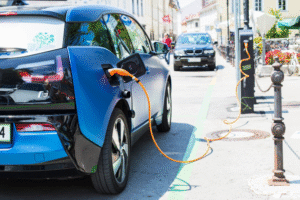 BMW car charging on the side of the street for the media analytics report how BMW takes the lead among luxury electric vehicle makers in the Philippines.