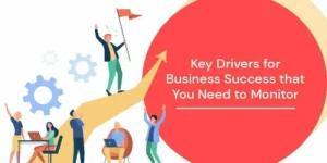 The image shows a group of people celebrating business success with one individual holding a flag atop an upward-pointing arrow, symbolizing achievement. The text on the image reads "Key Drivers for Business Success You Need to Know."